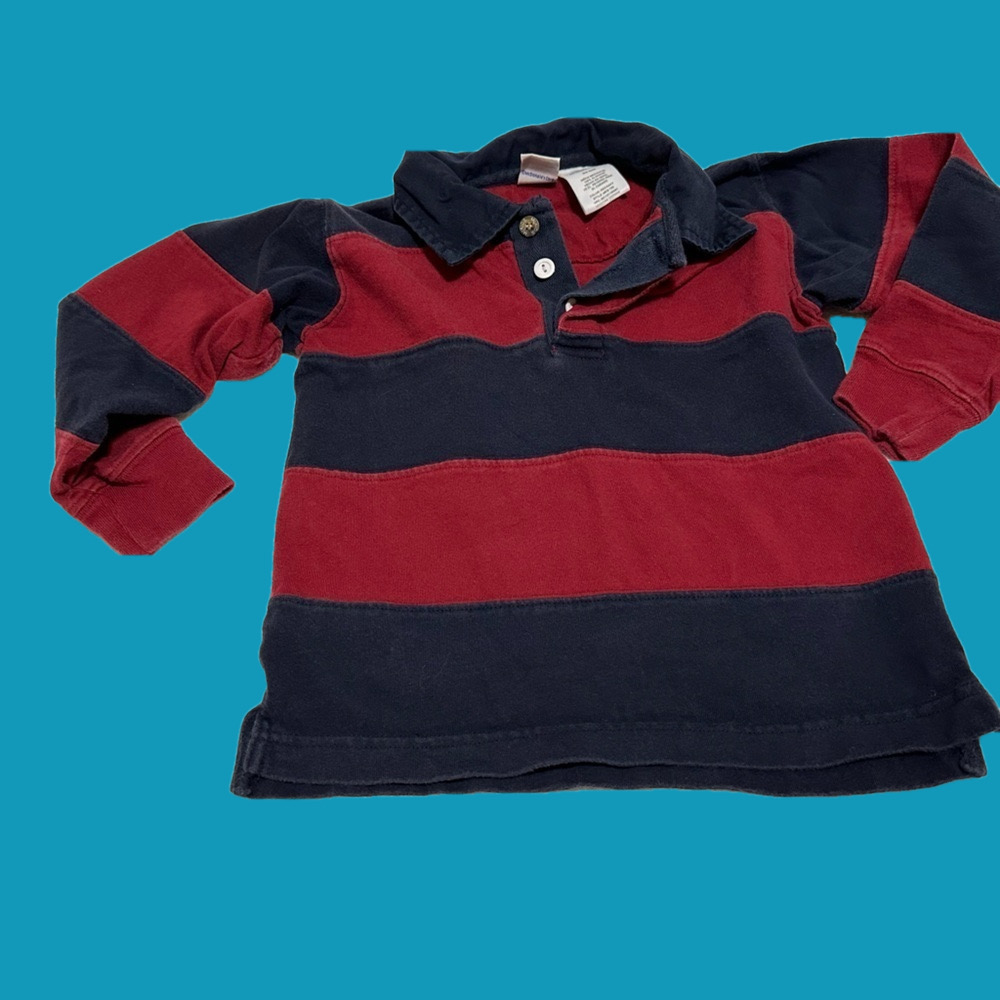 Boys McKids long sleeved rugby shirt in red/blue stripes. Size Medium (6).